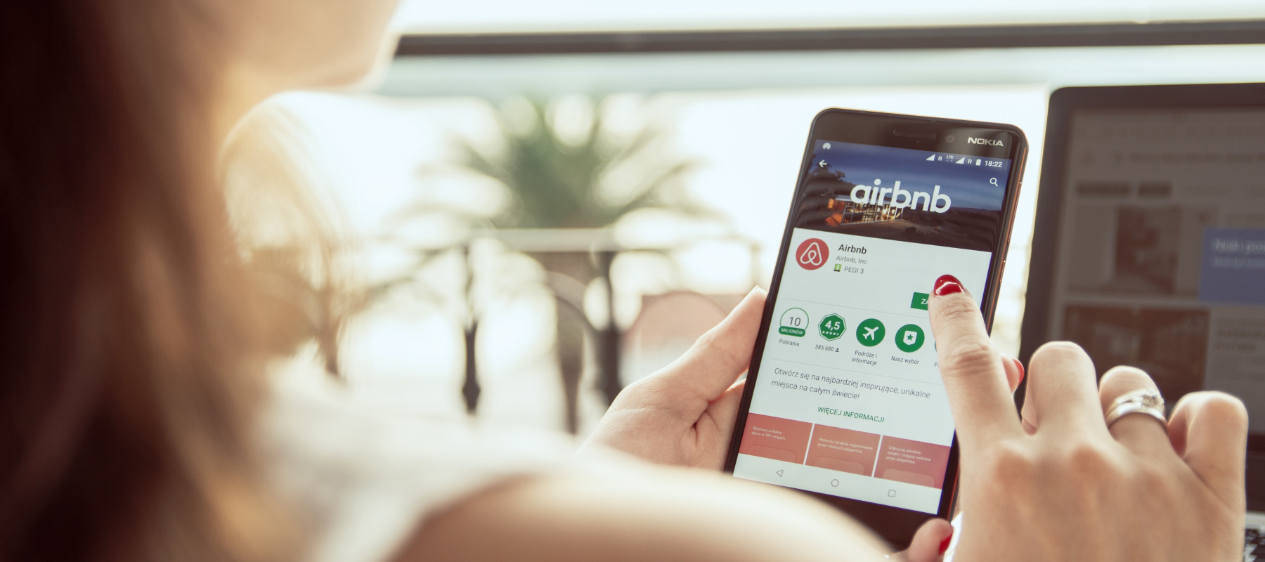 A woman on the Airbnb mobile app.