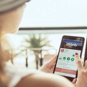 A woman on the Airbnb mobile app.