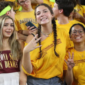 Arizona State students pose for a picture at a home basketball game.