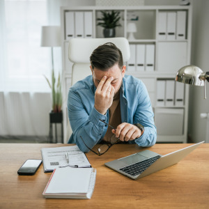 Man stressed about his finances.