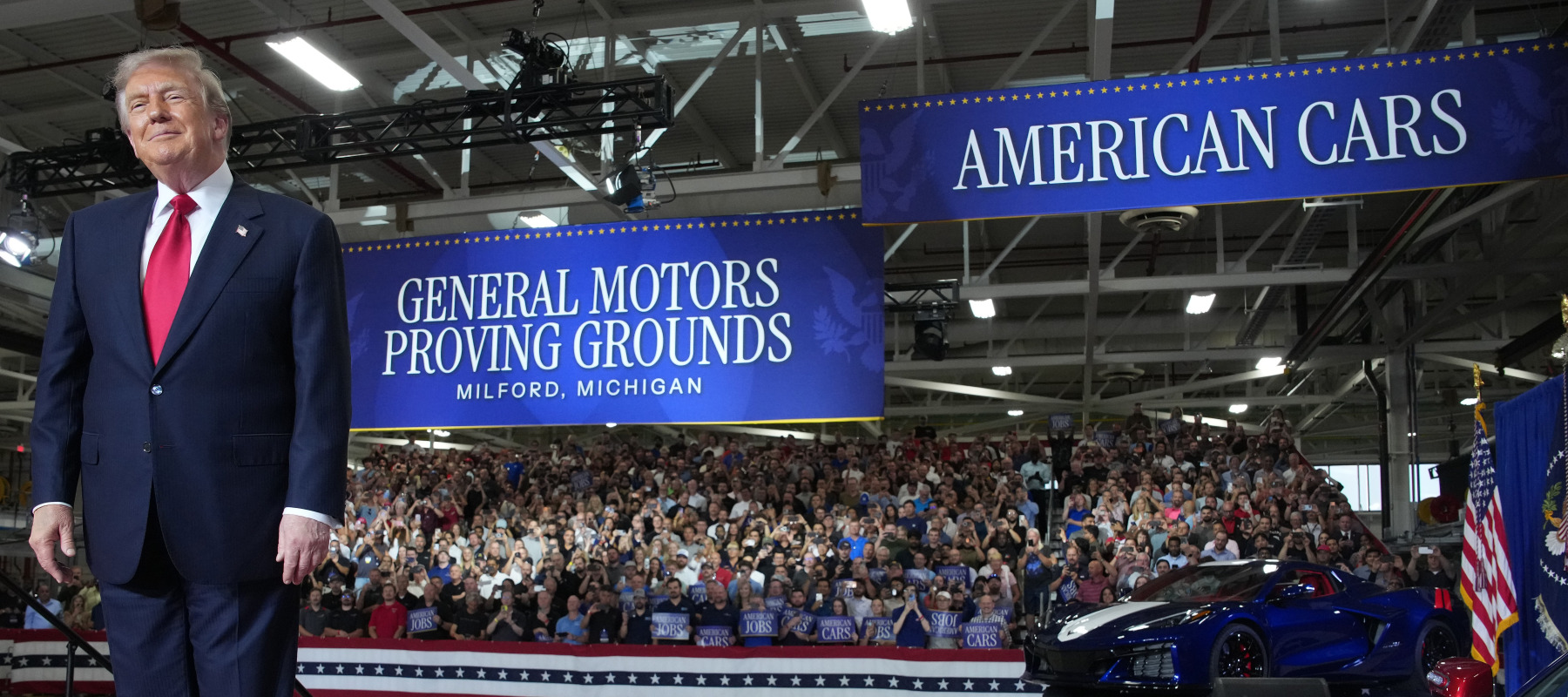 U.S. President Donald Trump greets the audience before speaking at General Motors’ Milford Proving Grounds on July 27, 2026