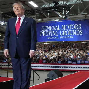 U.S. President Donald Trump greets the audience before speaking at General Motors’ Milford Proving Grounds on July 27, 2026