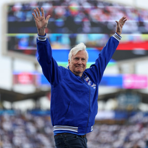 LA Dodgers owner and CEO Mark Walter waving to the crowd.