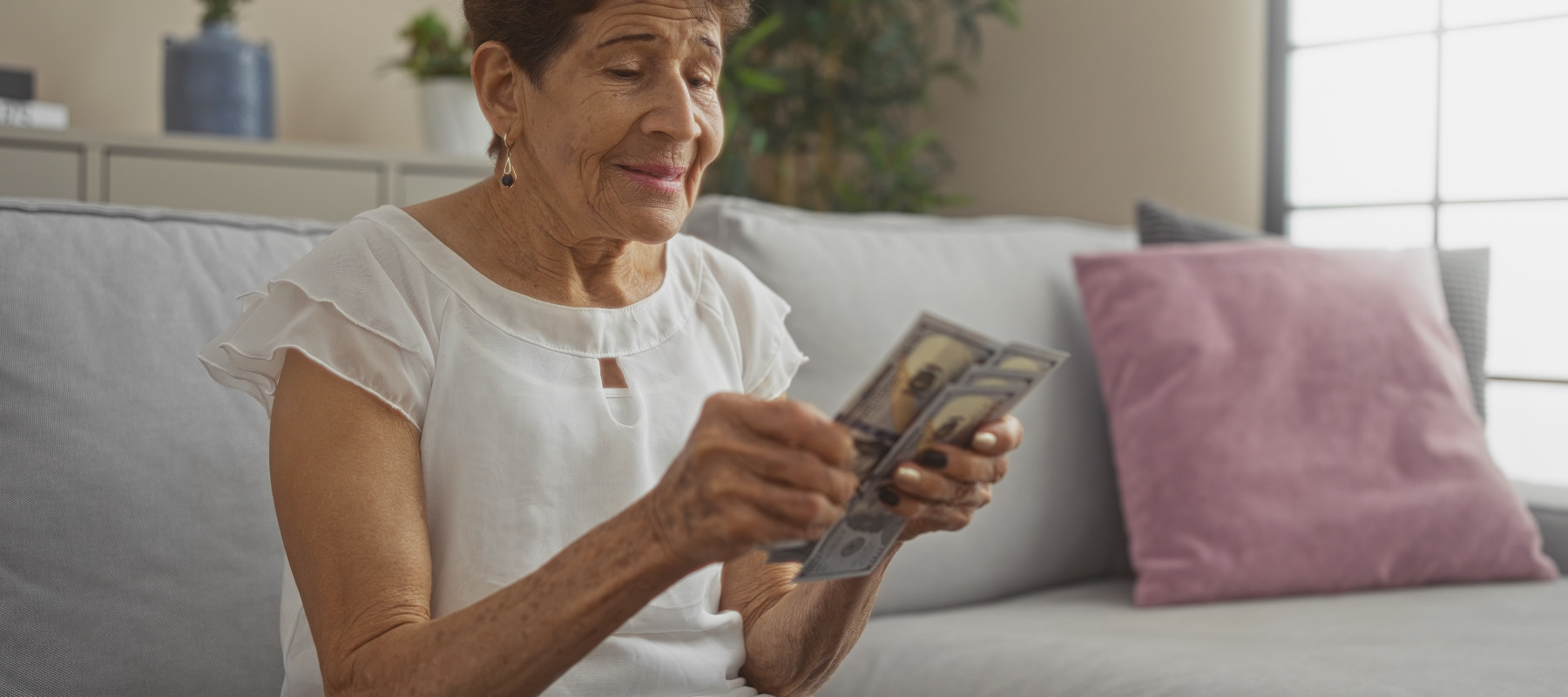 woman counting us dollars