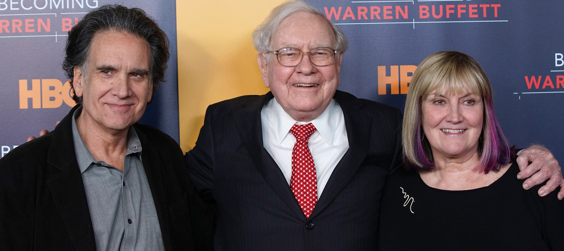 Warren Buffett with two of his three adult children, Peter Buffett and Susie Buffett.