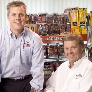 Alt Text: Photo of Jack and Troy Link and a bag of Jack Link's beef jerky