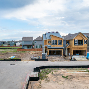 An aerial view of houses undergoing construction in a Texas neighborhood.