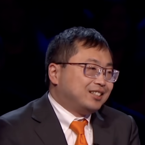 A photo of Jamie Ding and Ben Affleck on Who Wants to Be a Millionaire