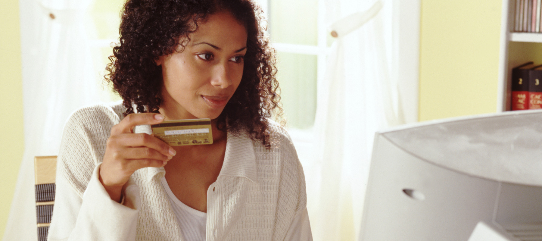 Woman shopping online with her credit card.