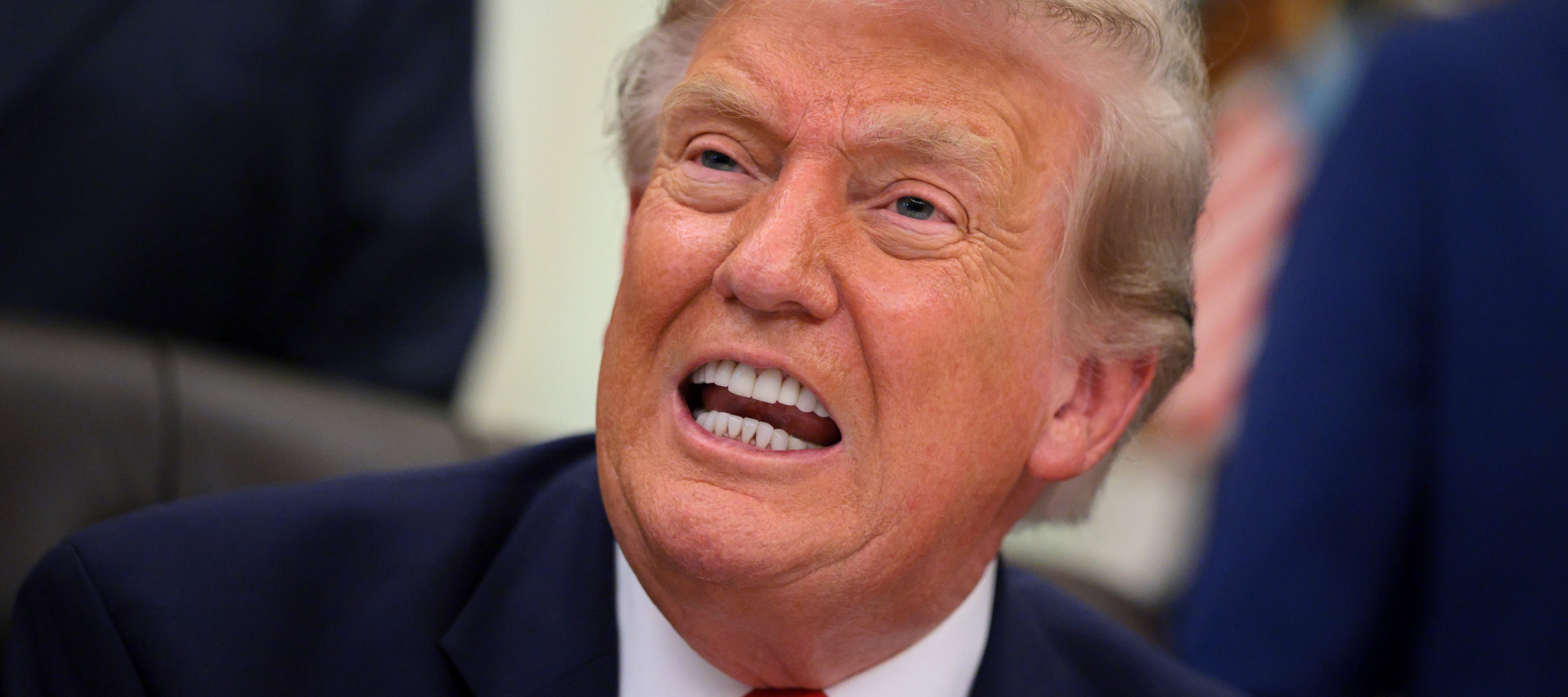 U.S. President Donald Trump speaks during an announcement to renovate Washington Dulles International Airport, in the Oval Office of the White House on July 29.