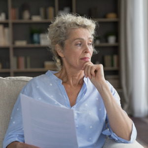 A photo of a middle-ages woman thinking