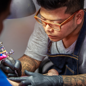 A photo of a man getting a tattoo