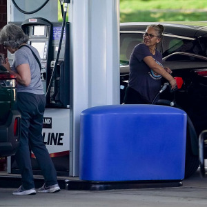 Photo of woman filling up at Costco gas station