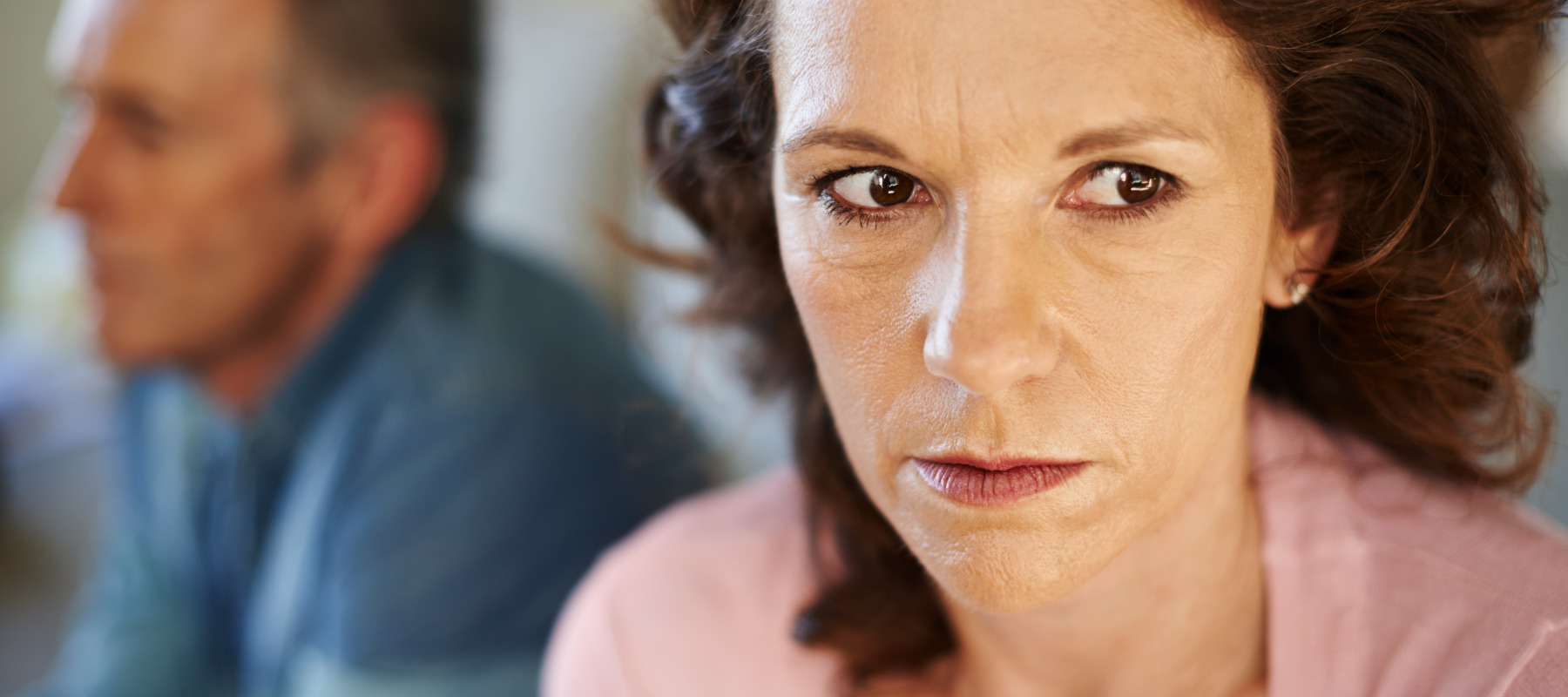 woman worried with man in background