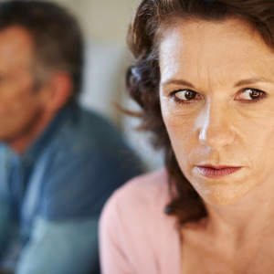 woman worried with man in background