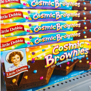 Photo of James Powell mug shot and package of Little Debbie Cosmic Brownies