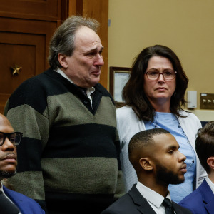 Dean and Michelle Nasca, who filled a lawsuit against TikTok for the death of their son Chase, stand as TikTok CEO Shou Zi Chew testifies before a House committee in 2023.