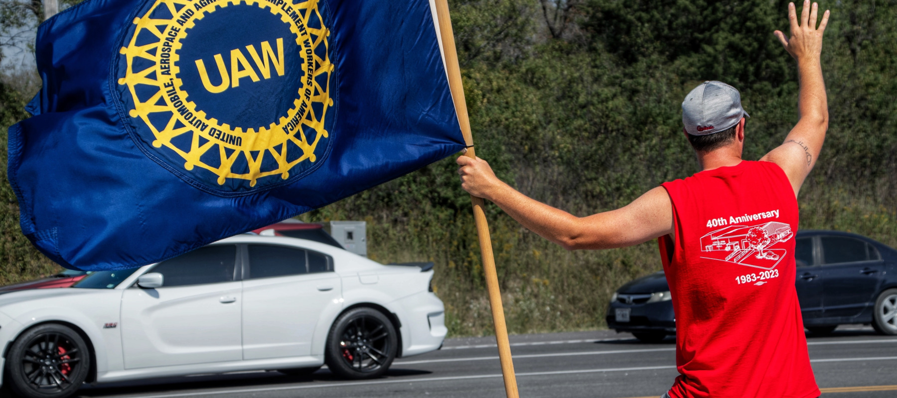 Member of the United Auto Workers pickets outside of General Motors in 2023