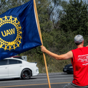 Member of the United Auto Workers pickets outside of General Motors in 2023