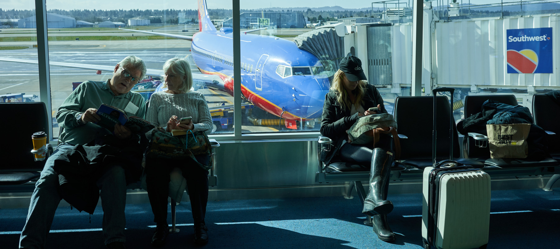 People wait to board their Southwest Airlines flight.