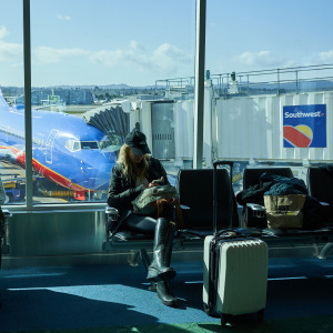 People wait to board their Southwest Airlines flight.
