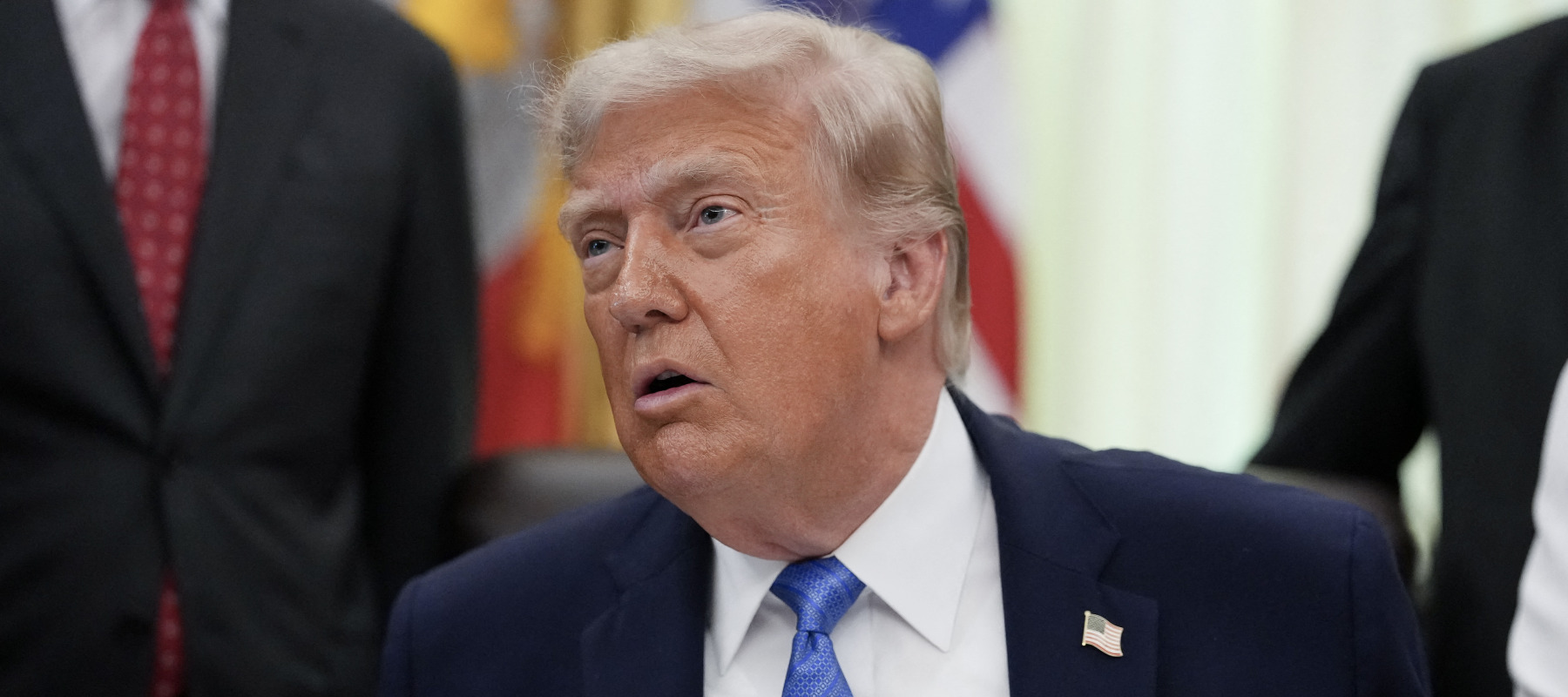 President Donald Trump speaks during a signing ceremony for the "Secure America Act" in the Oval Office of the White House.