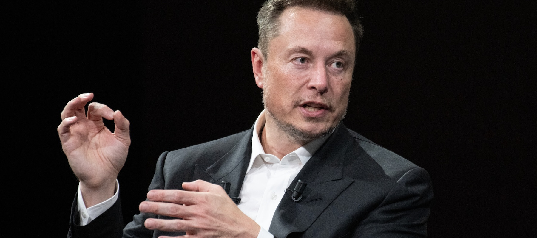 SpaceX CEO Elon Musk speaking at an event.