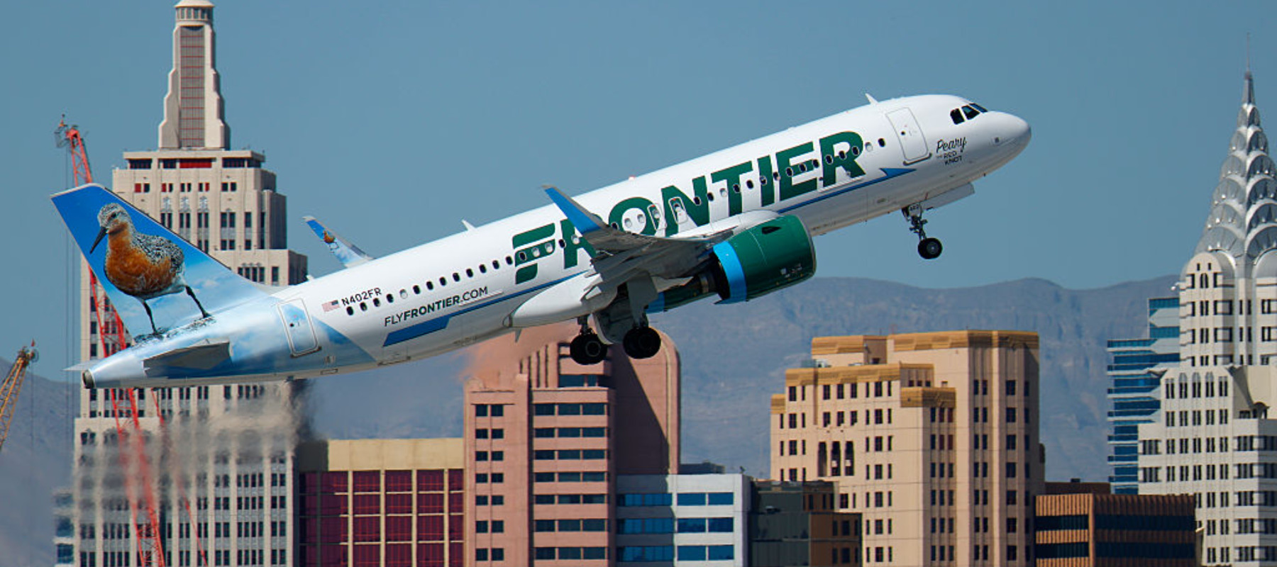 A Frontier Airlines Airbus A320 airplane departs from Harry Reid International Airport.