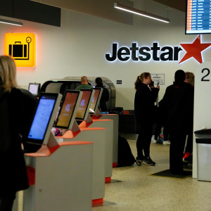 People lined up at Jetstar airport booth
