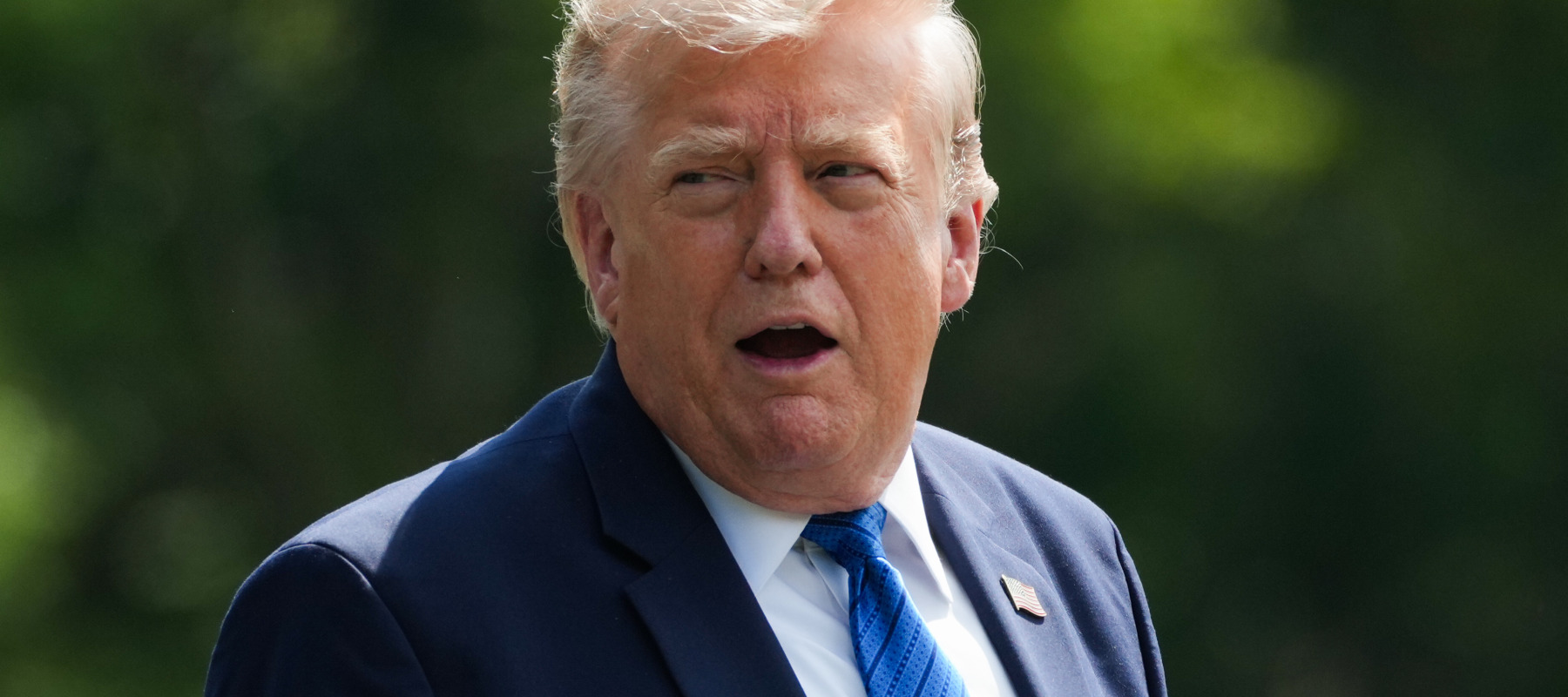 U.S. President Donald Trump departs after a Cabinet meeting at Camp David on July 31.
