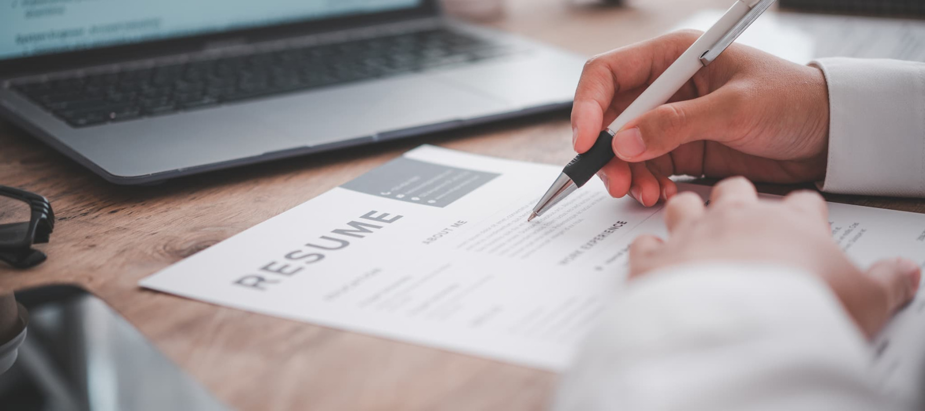 A photo of a recruiter reviewing a resume