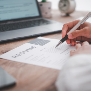 A photo of a recruiter reviewing a resume