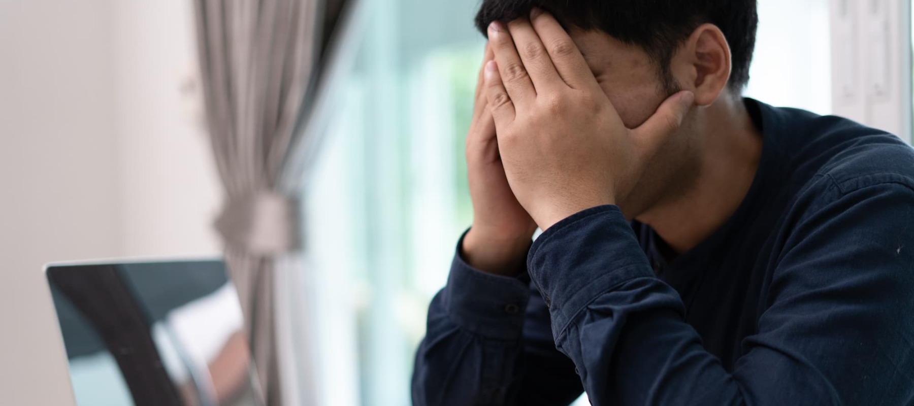 A photo of a man stressed about money