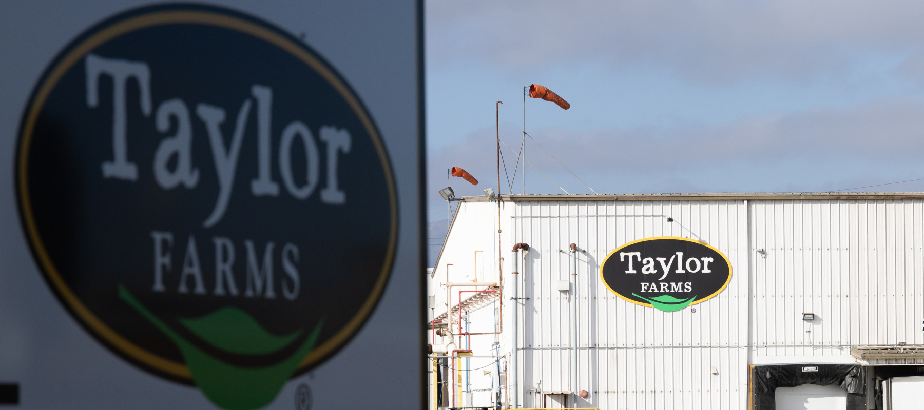 A Taylor Farms sign is displayed at one of their facilities in California.