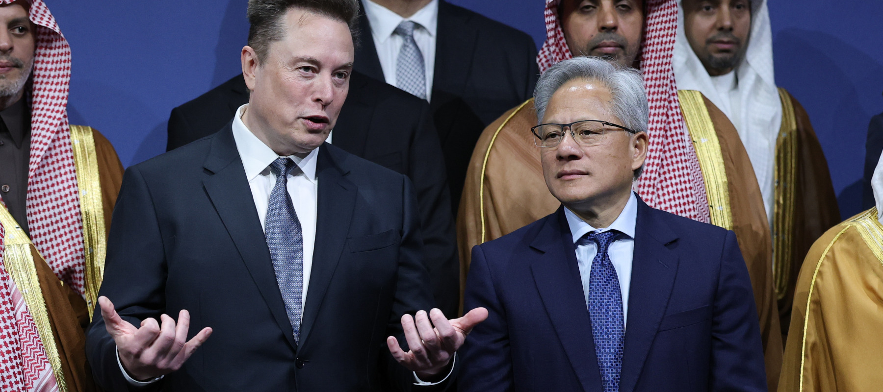 Tesla CEO Elon Musk talks with Nvidia CEO Jensen Huang during the U.S.-Saudi Investment Forum at the Kennedy Center.
