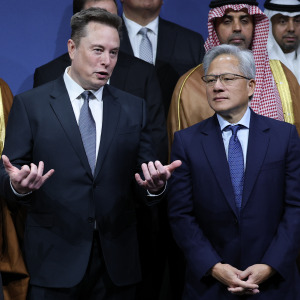 Tesla CEO Elon Musk talks with Nvidia CEO Jensen Huang during the U.S.-Saudi Investment Forum at the Kennedy Center.