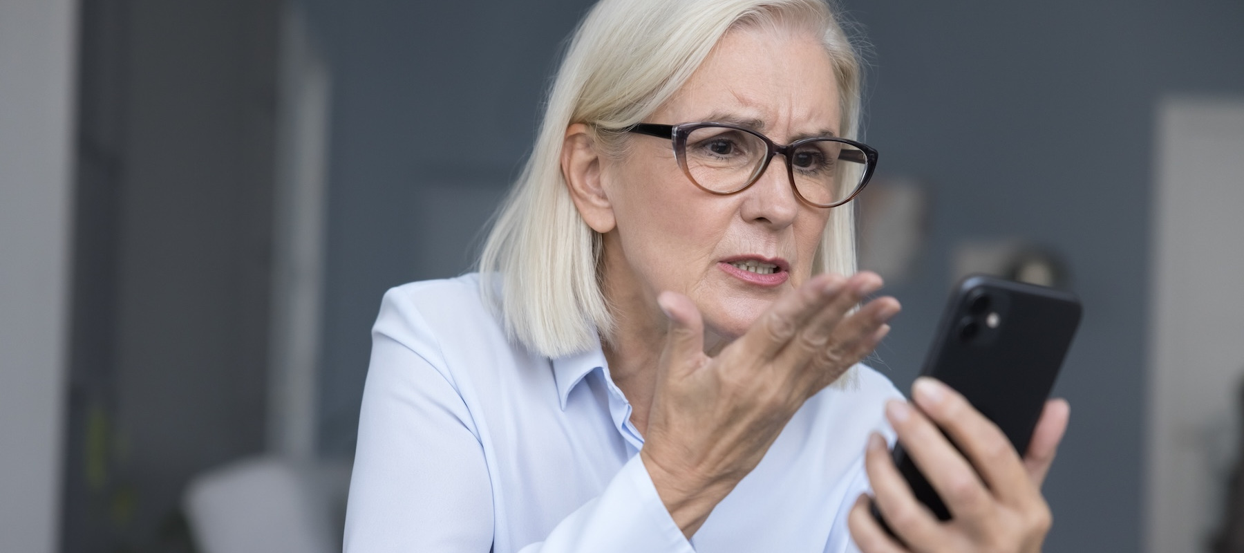 Woman annoyed after receiving spam call.