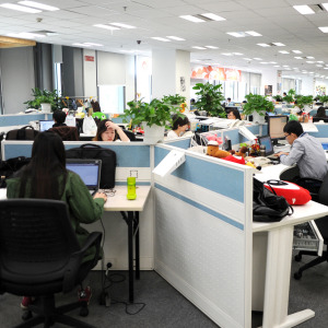 Employees work in an office in China
