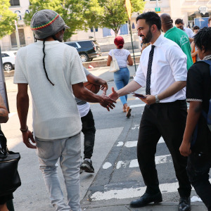 Mayor Zohran Mamdani greets voters in New York City.