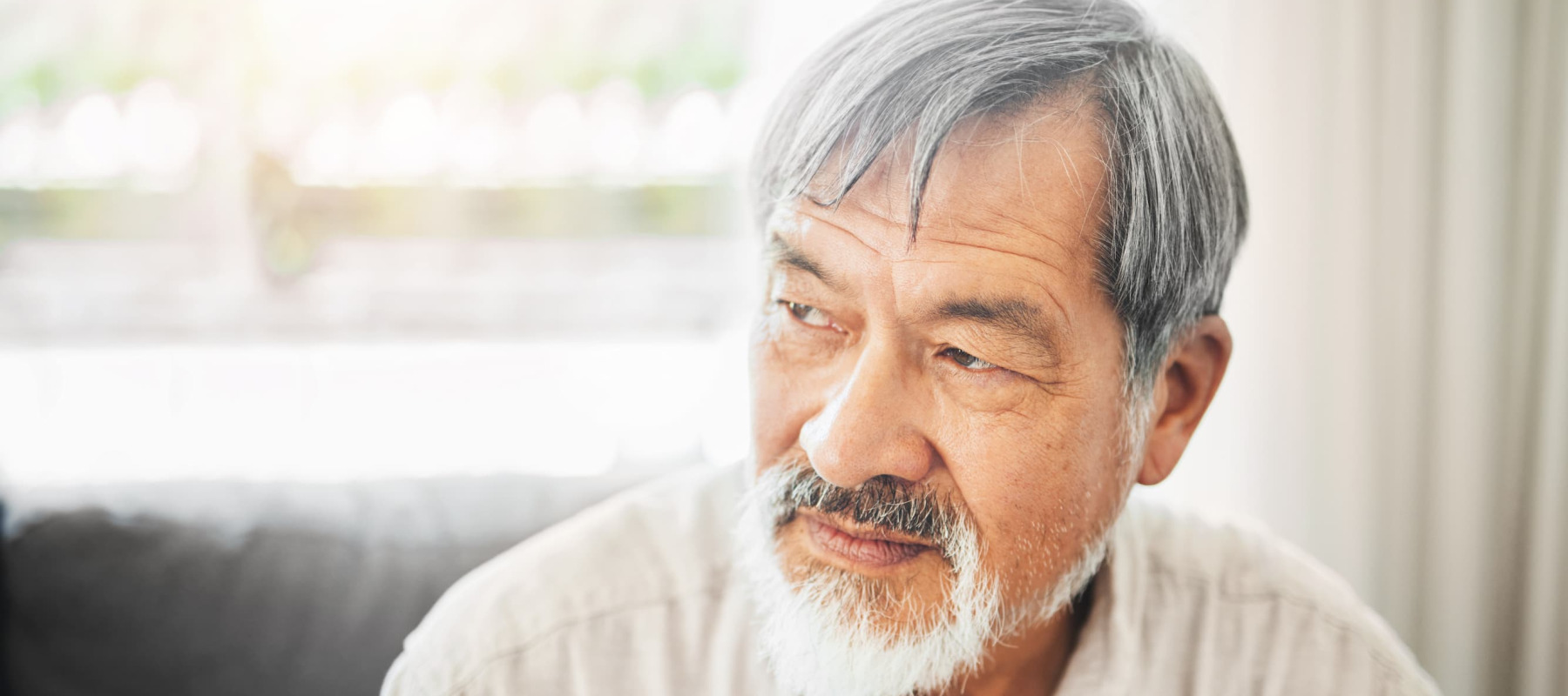 A photo of a middle-aged man thinking
