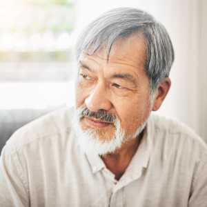 A photo of a middle-aged man thinking