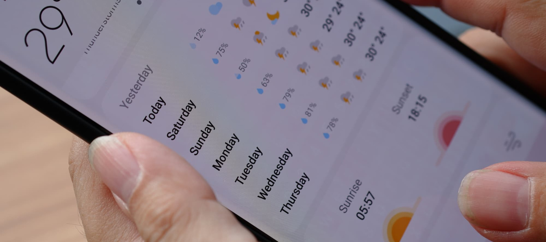 A photo of someone using a weather app