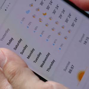 A photo of someone using a weather app