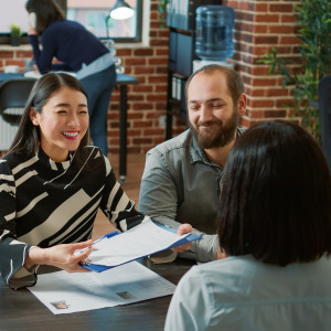 Concept of a panel interview depicted with one candidate being interviewed.