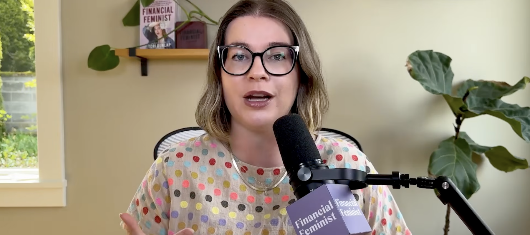 Screenshot of money expert Tori Dunlap hosting a podcast episode posted to YouTube.