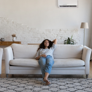 Young woman relaxing in an apartment rental, presumably on vacation.
