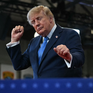 Trump dances as he departs after delivering remarks at the Nassau County Police Academy Center.