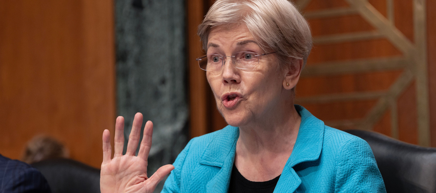 Ranking member Sen. Elizabeth Warren (D-MA) questions Federal Reserve Chairman Kevin Warsh as he testifies before the Senate Banking Committee on Capitol Hill on July 15.