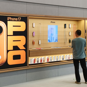 Apple products advertised at a flagship store for the tech giant.