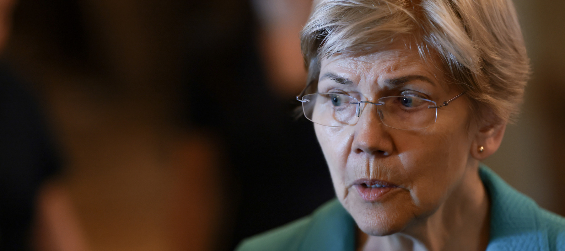 Elizabeth Warren speaking to reporters